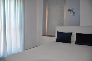 A bed or beds in a room at Yades elegant villa 2 minutes away from the beach