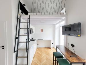 Televízia a/alebo spoločenská miestnosť v ubytovaní Grand Theater Apartments + 3 fotografie