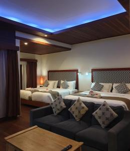 A bed or beds in a room at Kencana Garden