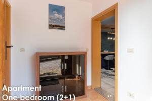 TV a/nebo společenská místnost v ubytování Glamour Apartments Vrsar