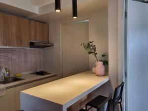 a kitchen with a counter with a vase on it at Kasa Bae in Tagaytay