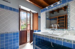 a bathroom with a sink and a mirror at Vivienda Vacacional Leo in Andrín +27 photos