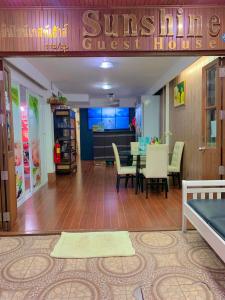 a dining room with a table and chairs at Sunshine Hotel in Hua Hin