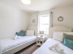 Ένα ή περισσότερα κρεβάτια σε δωμάτιο στο Amaranta