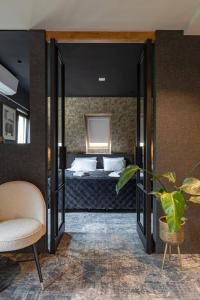 Katil atau katil-katil dalam bilik di Boutique Hotel de Drentse Liefde