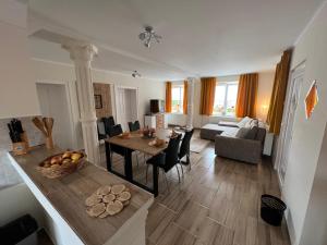 A bed or beds in a room at Négy Évszak Vendégház