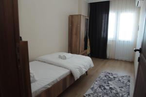 Ein Bett oder Betten in einem Zimmer der Unterkunft Kıvanç Residence