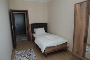 Ein Bett oder Betten in einem Zimmer der Unterkunft Kıvanç Residence