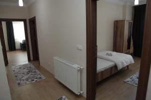 Ein Bett oder Betten in einem Zimmer der Unterkunft Kıvanç Residence