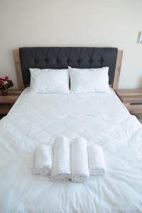 Ein Bett oder Betten in einem Zimmer der Unterkunft Kıvanç Residence