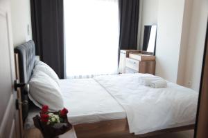 Ein Bett oder Betten in einem Zimmer der Unterkunft Kıvanç Residence