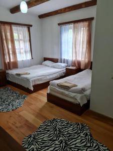 Postel nebo postele na pokoji v ubytování Guest House Shina