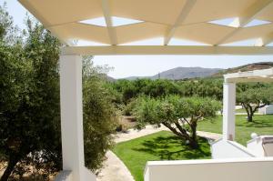 a view from the porch of a house with trees at Villa Dimitris in Palekastron
