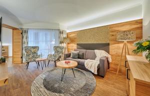 a living room with a couch and a table at Landhotel Schneider in Riedenburg