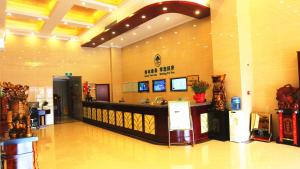 a lobby with a bar in a shopping center at Greentree Inn Mozitan Road Yiwu Small Commodities Wholesale City in Lu'an