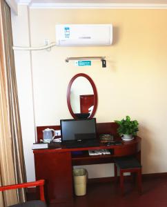 Een TV en/of entertainmentcenter bij Greentree Inn Mozitan Road Yiwu Small Commodities Wholesale City
