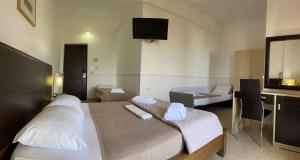 Postel nebo postele na pokoji v ubytování Galini Hotel
