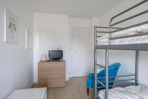 Posteľ alebo postele v izbe v ubytovaní À 500m de la plage, appartement pour 7