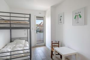 Posteľ alebo postele v izbe v ubytovaní À 500m de la plage, appartement pour 7
