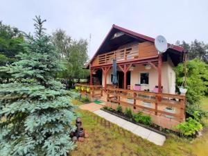 Vonkajšia záhrada v ubytovaní Domek letniskowy Mały Mermet