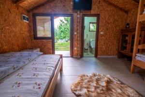 a bedroom with two beds and a bathroom at Holiday bungalows with pool in Plav +41 photos