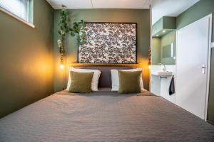 En eller flere senge i et værelse på Hakuna Matata - 4p apartment Groningen Center