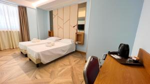 Posteľ alebo postele v izbe v ubytovaní Catania Sea Palace Hotel