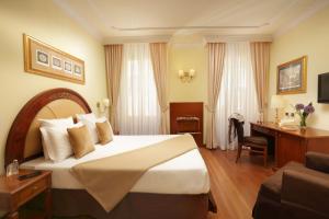 Postel nebo postele na pokoji v ubytování Hotel Homs
