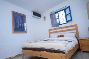Ένα ή περισσότερα κρεβάτια σε δωμάτιο στο USHA Guest House