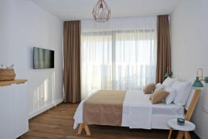 Posteľ alebo postele v izbe v ubytovaní Villa Seabatical