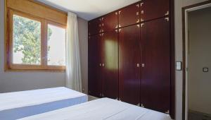 Ein Bett oder Betten in einem Zimmer der Unterkunft CALA 51 - Smart Stay in Blanes Most Exclusive Cove