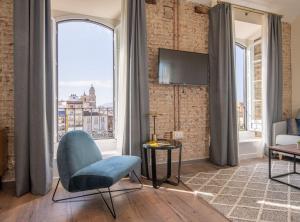 Televízia a/alebo spoločenská miestnosť v ubytovaní Home Art Apartments Málaga