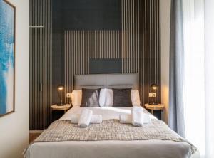 Posteľ alebo postele v izbe v ubytovaní Home Art Apartments Málaga