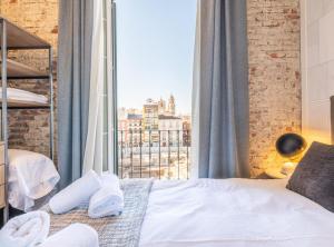 Posteľ alebo postele v izbe v ubytovaní Home Art Apartments Málaga