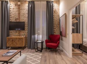 Televízia a/alebo spoločenská miestnosť v ubytovaní Home Art Apartments Málaga