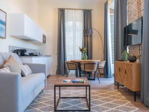 Televízia a/alebo spoločenská miestnosť v ubytovaní Home Art Apartments Málaga
