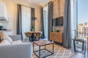 Televízia a/alebo spoločenská miestnosť v ubytovaní Home Art Apartments Málaga