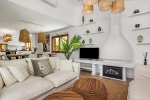 A television and/or entertainment centre at Villa Ibiza