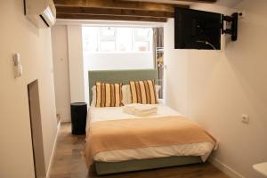 Ένα ή περισσότερα κρεβάτια σε δωμάτιο στο Apartamentos do Corgo