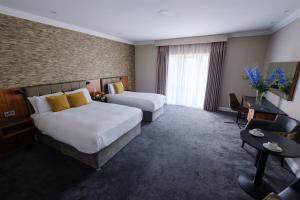 Postel nebo postele na pokoji v ubytování Talbot Hotel Midleton