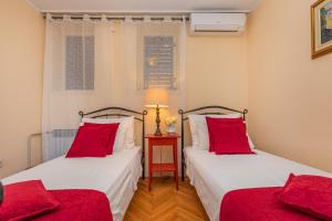 Postel nebo postele na pokoji v ubytování Apartment Big One Dubrovnik
