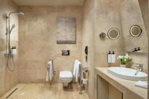 a bathroom with a toilet and a sink at Crowne Plaza - Istanbul Tuzla Viaport Marina, an IHG Hotel in Istanbul