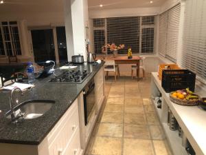a kitchen with a sink and a counter top at 4 Duke Street Flat#3 in Mossel Bay