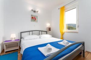 Postel nebo postele na pokoji v ubytování Apartmani RUBESSA