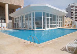 Bazén v ubytovaní Torres de Manantiales Apart Hotel alebo v jeho blízkosti