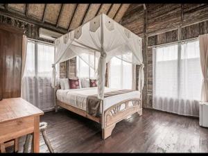 Postel nebo postele na pokoji v ubytování Ananda JJ Ubud Resort & Spa