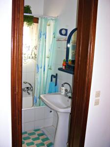 a bathroom with a sink and a shower and a toilet at Panoramic Views Home in Hydra, Greece in Hydra