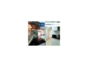 Kuchyň nebo kuchyňský kout v ubytování Elisa apartament