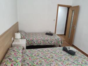 Tempat tidur dalam kamar di Apartamento Como en tu casa