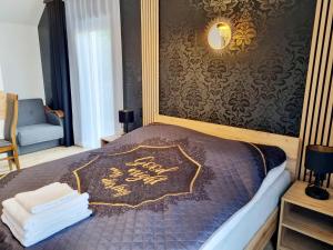 Postel nebo postele na pokoji v ubytování Willa "KomaNcza" Szczawnica
